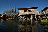 Inle Lake Myanmar. All the buildings are constructed on piles. Residents travel around by canoe, but there are also bamboo walkways and bridges over the canals, monasteries and stupas. 